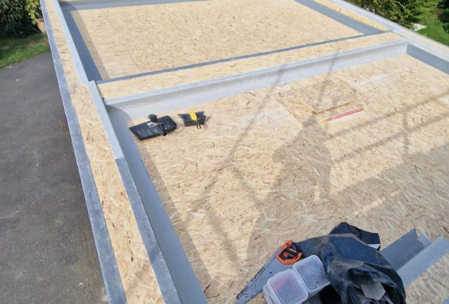 Flat roof repair Limerick showing fibreglass roof installation with new decking and edge detailing