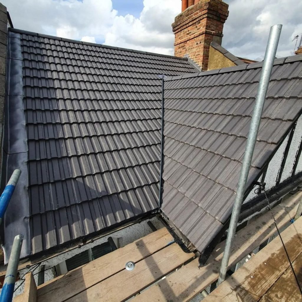 Tiled Roof Replacement Clarecastle with new roof tiles and lead flashing around parapet walls and chimney breast