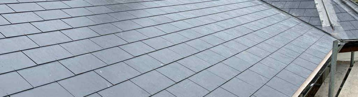 Exposed roofing nails on ridge cap shingles before repair in Limerick